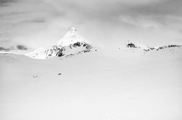 istock Snowcapped mountain peak lit by sun in Jotunheimen National Park 512419257
