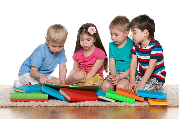 istock Little children with books on the floor 512419413