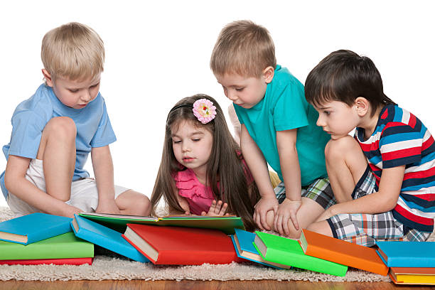 istock Four kids with books 512419415