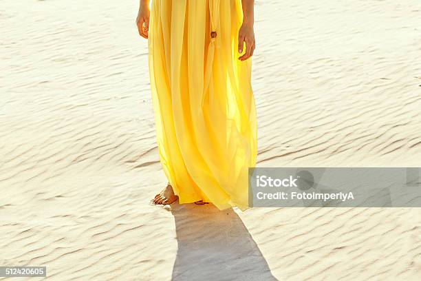 Girl In A Yellow Dress Walking Bbeach Stock Photo - Download Image Now - Relaxation, Adult, Barefoot