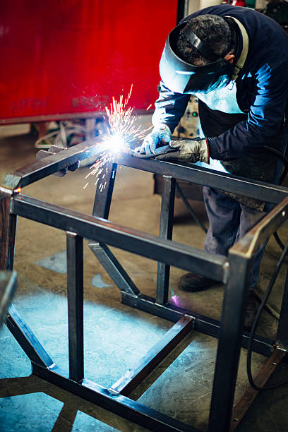 istock Metal Worker Welding in factory 512433264