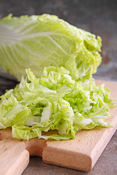 istock Chinese cabbage sliced on a wooden board 512435362