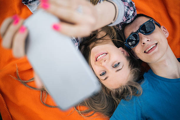 istock Teenager couple making selfie 512435526