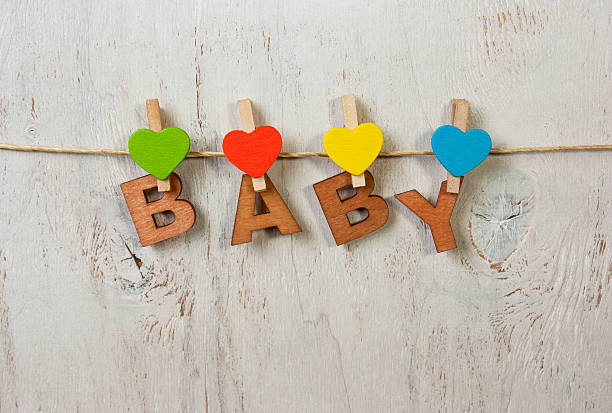 the word Baby and hearts on a white background old