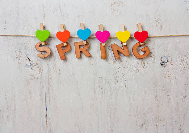istock word spring and colored hearts on a white background wooden 512438156