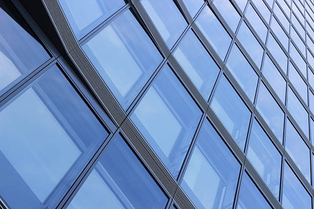 istock Hi-tech building. Diagonal view of modern glass facade. Glass matrix. 512438674