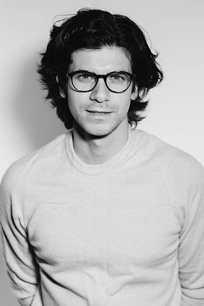 istock Modern fashionable young man in glasses 512439980