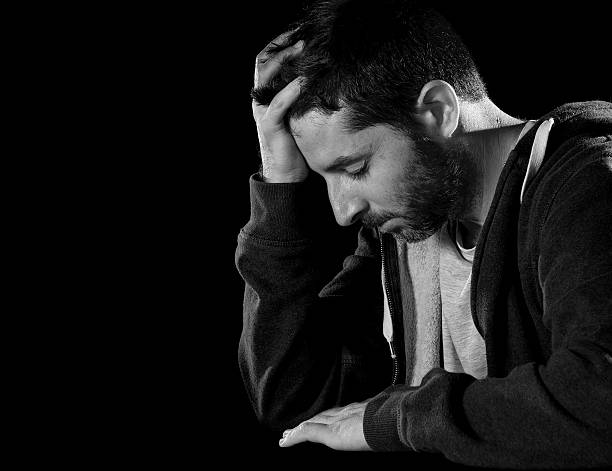 istock desperate man suffering emotional pain, grief and deep depression 512450275