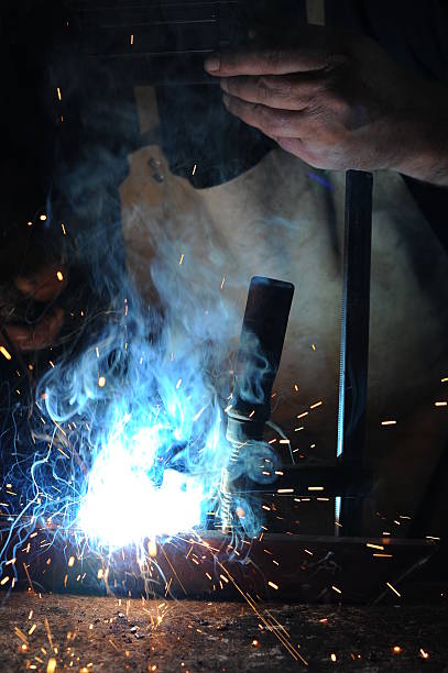istock welder  welding metal with electrode 512451191