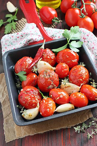 istock Tomatoes baked with spices, herbs ,garlic and olive oil 512451629