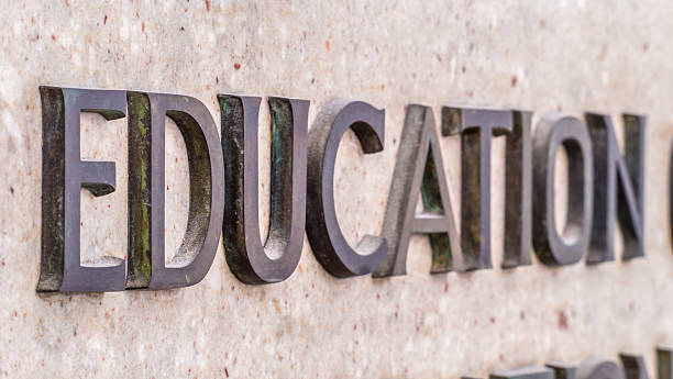 istock Education, written in tarnished brass letters on marble 512451769