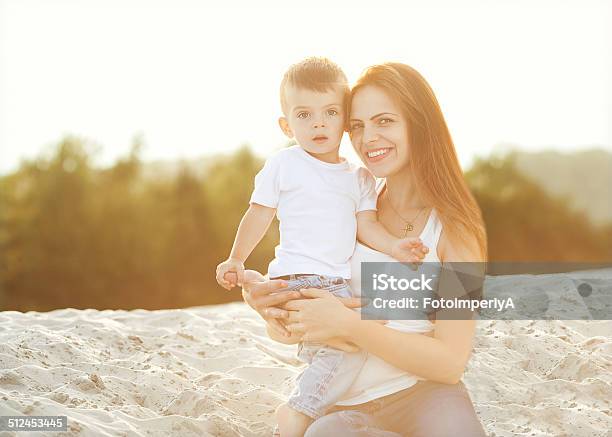 Happy Mother And Son In The Mountains Playing Stock Photo - Download Image Now - Adult, Baby - Human Age, Boys