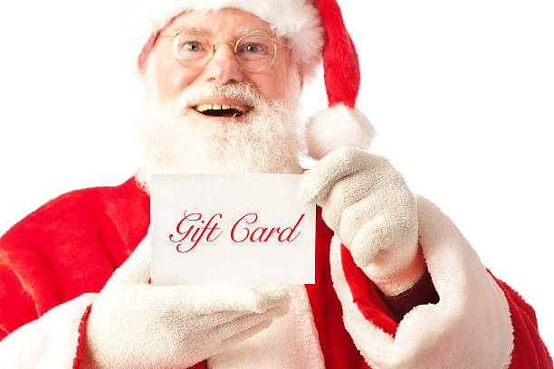 istock Happy Santa Claus Holding Gift Card 512454029