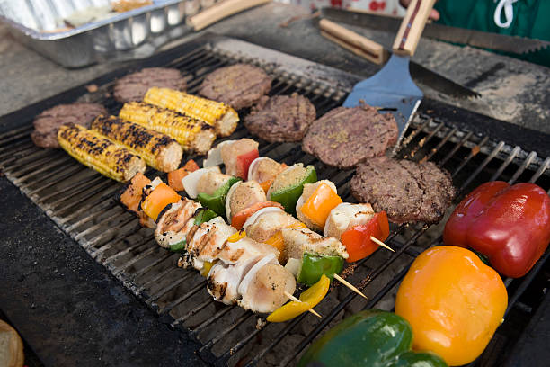 istock Burgers and Kebabs on Barbecue Grill 512454429