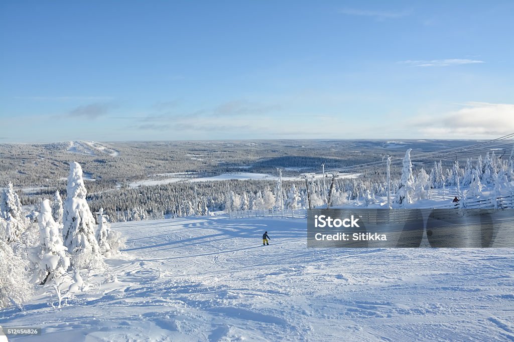 Ski slopes Ski slope and snow covered trees on sunny day in Lapland Finland Alpine Skiing Stock Photo