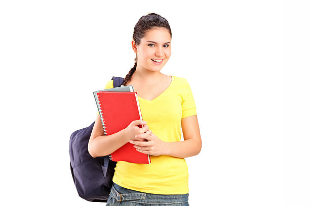 istock Schoolgirl holding books 512454887