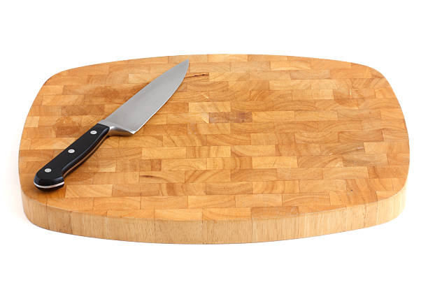 istock Traditional thick chopping board with a cooks knife. 512455555