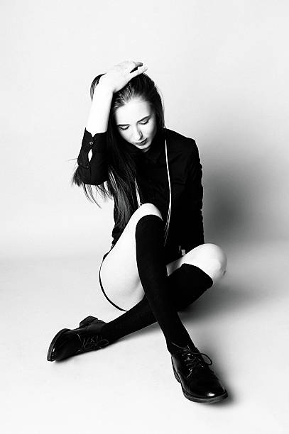 istock Young girl in black socks and shorts 512456588