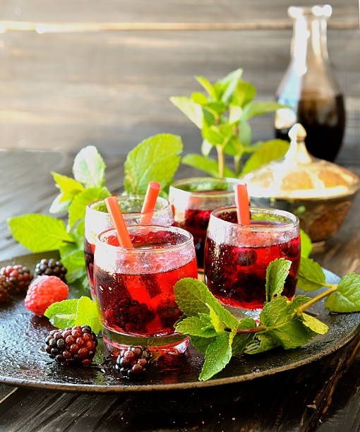istock berry juice in a glass with berries, selective focus 512457250