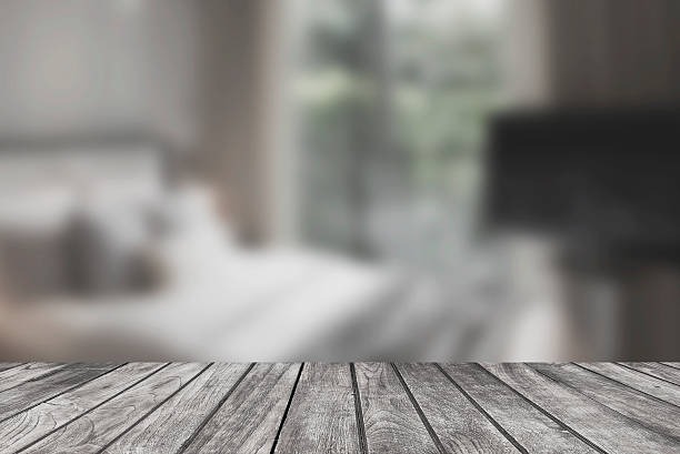 istock Wood Table Top And Blur Bedroom interior background. 512460280
