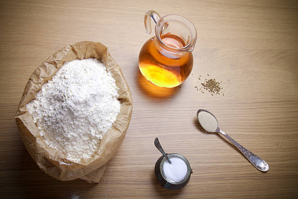 istock Ingredients for bread with saffron: flour, saffron water, yeast 512471964