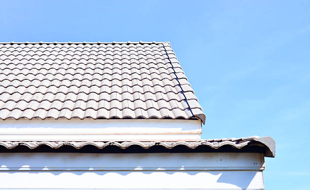 istock roof and blue sky 512472220