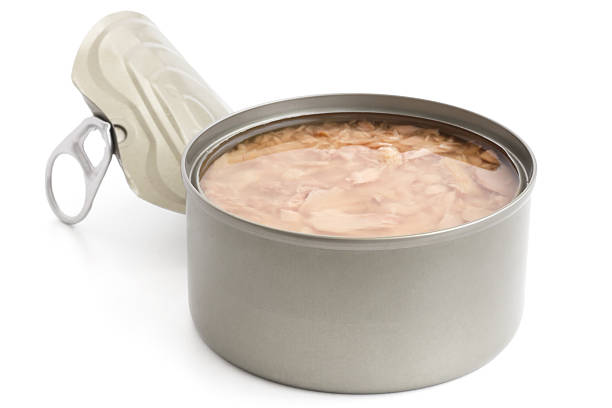 istock Open can with lid partly detached. Tuna in brine. 512474469