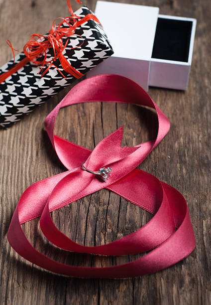 istock Beautiful pink ribbon with ring 512474614