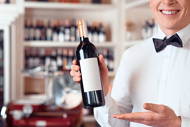 istock Professional sommelier holding wine bottle 512474626