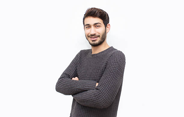 istock Portrait of smiling young man over white background 512475194