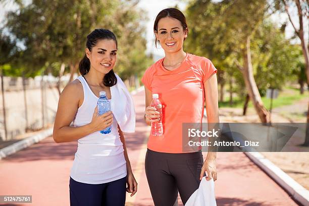 Beautiful Girls Drinking Water Stock Photo - Download Image Now - Adult, Adults Only, Athlete