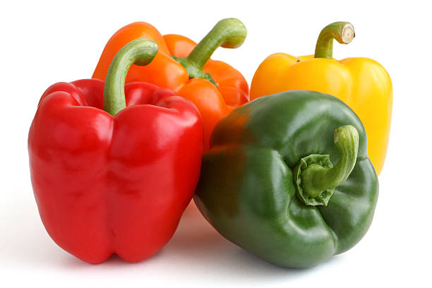 istock Red, yellow, orange and green peppers on white background. 512476065