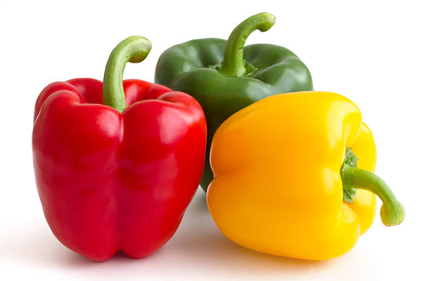 istock Red, yellow and green peppers on white background. 512476067