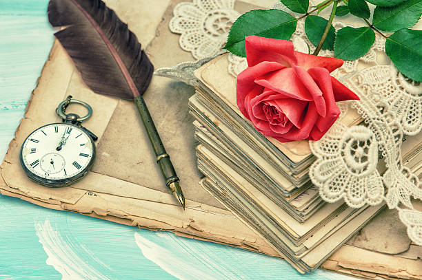 istock Old postcards, lace and red rose flower vintage 512477256