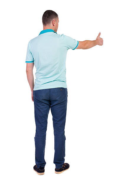 istock Back view of  man in checkered shirt shows thumbs up. 512478001