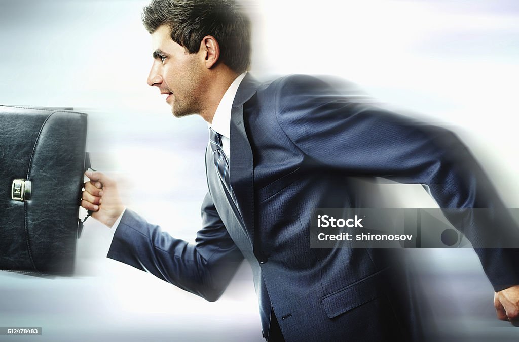 Haste Portrait of businessman hurrying somewhere Business Stock Photo