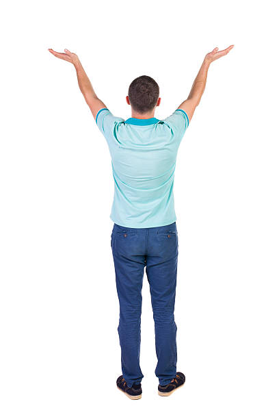 istock Back view of Beautiful man in jeans looking at wall 512478719