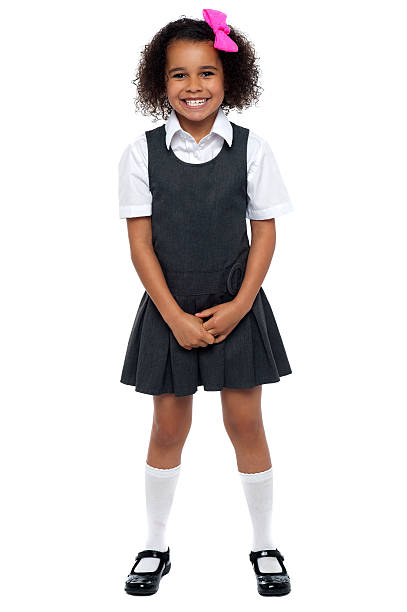istock Cheerful young kid in pinafore dress posing smilingly 512479253