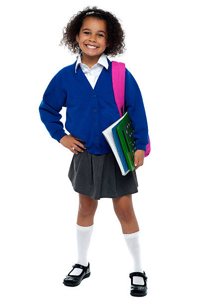 istock Girl in smart uniform holding notebook and calculator 512479257