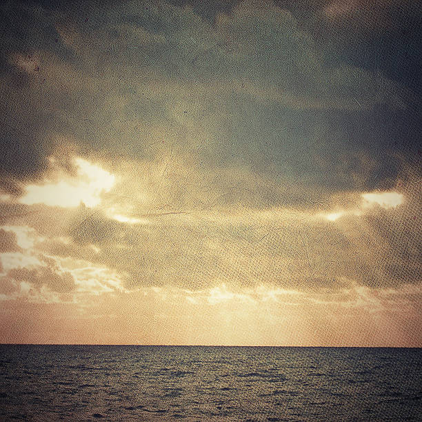 istock Sunset with Rays of Light over water. 512479497