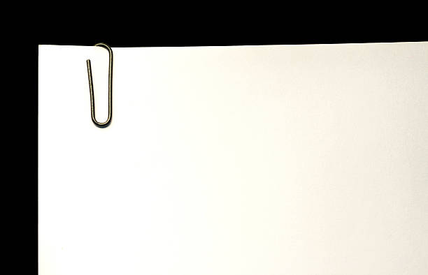 istock Black Paper Clip with Blank Paper 512480393