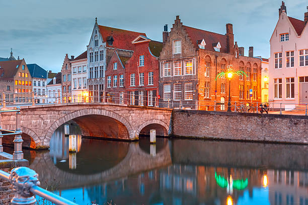istock Night Bruges canal and bridge, Belgium 512488716