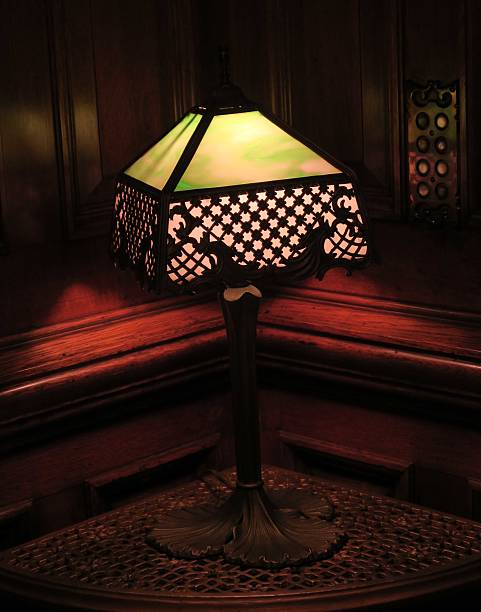 istock Antique lamp illuminated in dark room 512489054