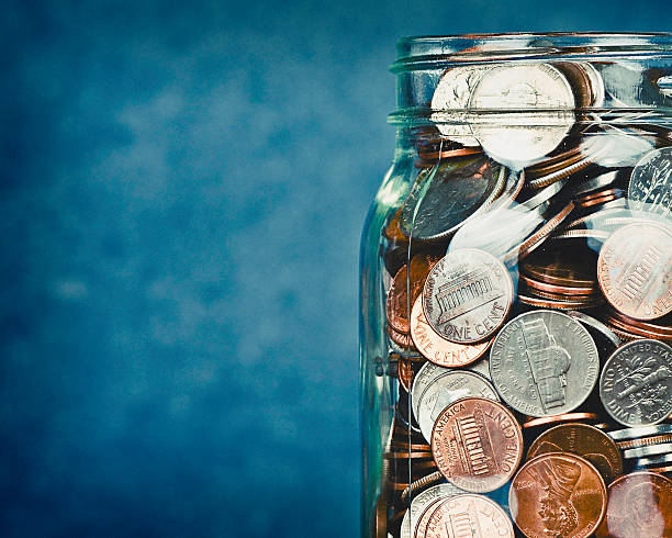 istock Money jar filled with American currency 512489090