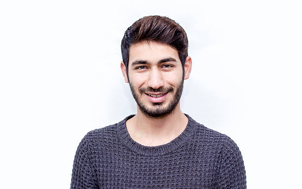 istock Portrait of smiling young man over white background 512490132