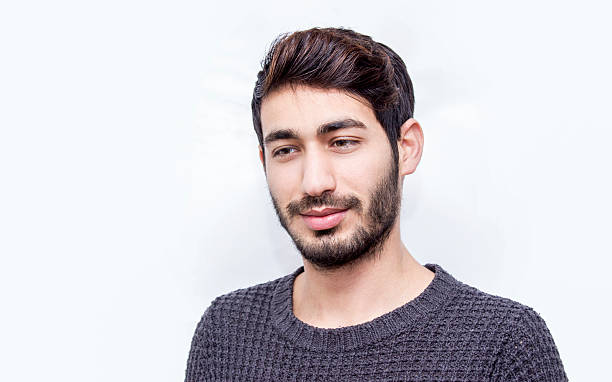 istock Portrait of smiling young man over white background 512490230