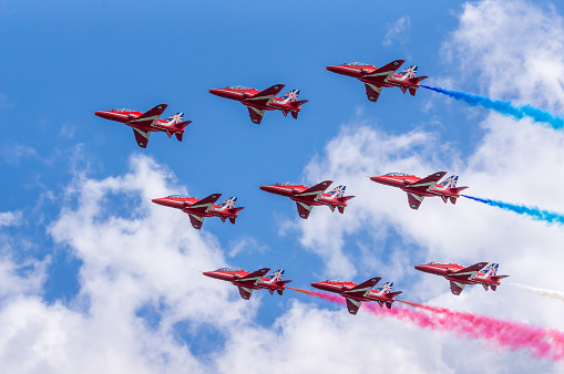 Dawlish, United Kingdom - August 23, 2014: The Royal Airforce Red Arrows Aerobatics Display Team Flying in Diamond Formation at the Dawlish Airshow