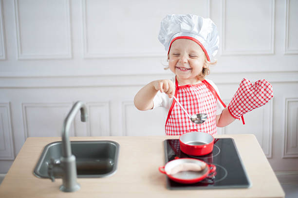 Cute little cook stock photo
