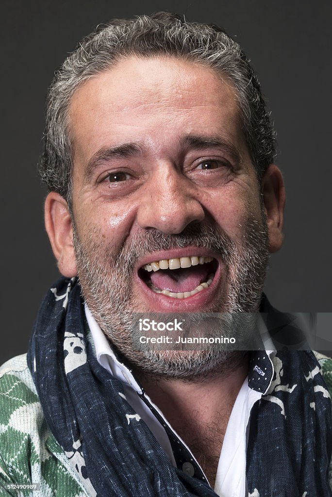 Mature man Laughing Mature gray haired man laughing 40-49 Years Stock Photo