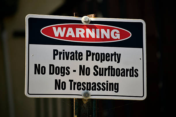 istock Warning - No Tresspassing, No Surfboards, No Dogs 512491859